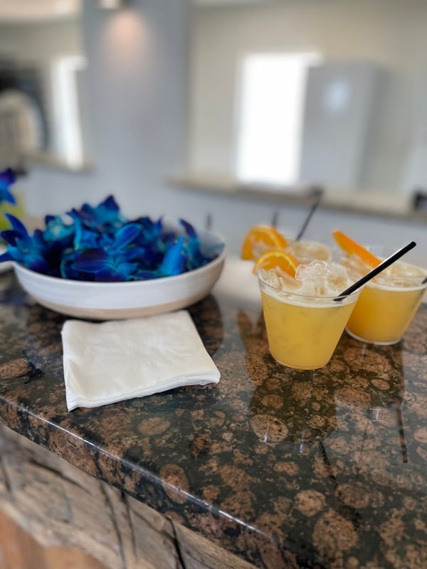 Fresh event cocktails with orange garnish
